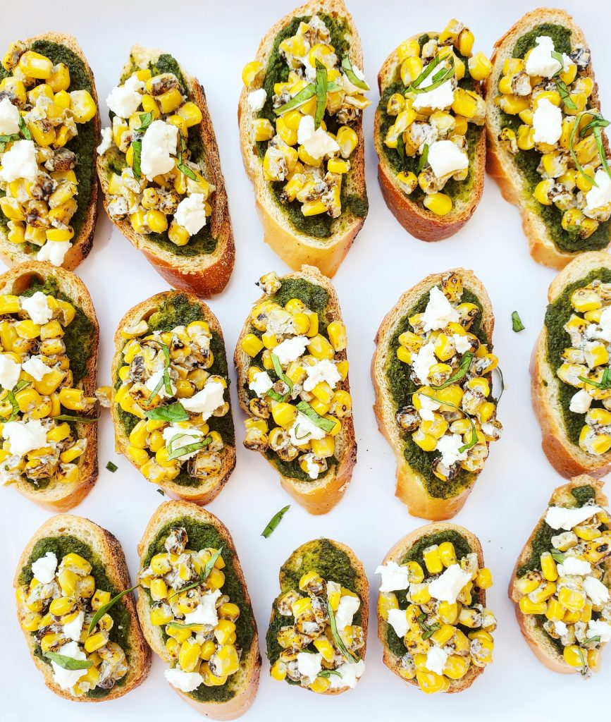 Corn and Goat Cheese Bruschetta with Pesto Spinach and Bacon