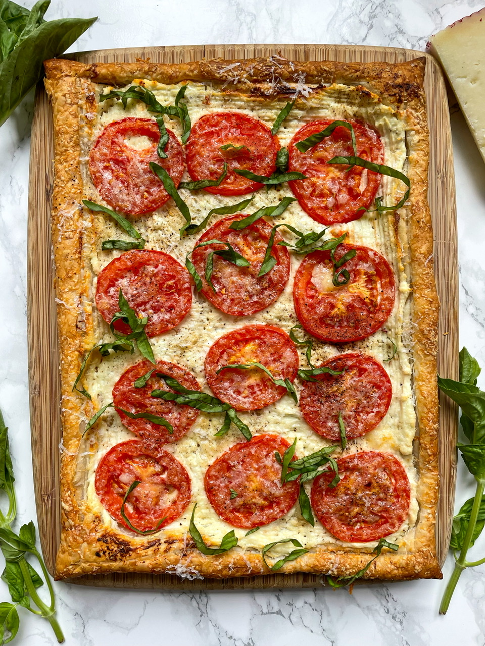 Tomato Tart on Puff Pastry Goat Cheese, Manchego, and Basil