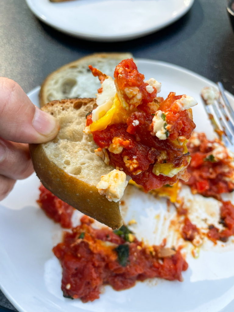 shakshuka with feta on top of sourdough bread