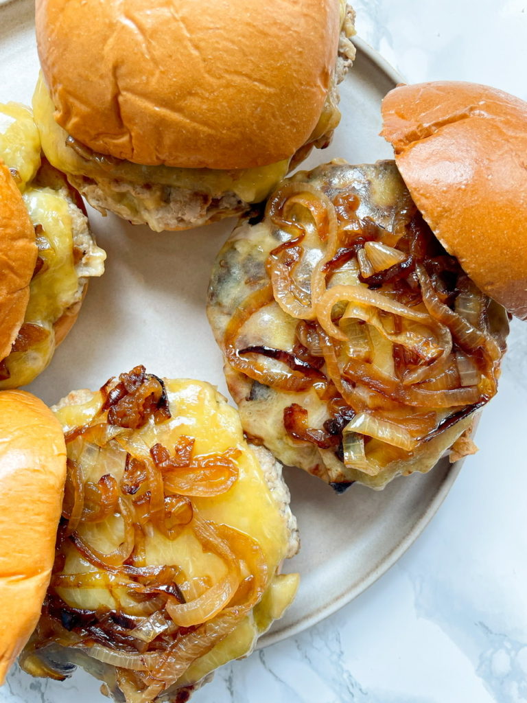 Pork and Apple Burgers with White Cheddar and Caramelized Onions