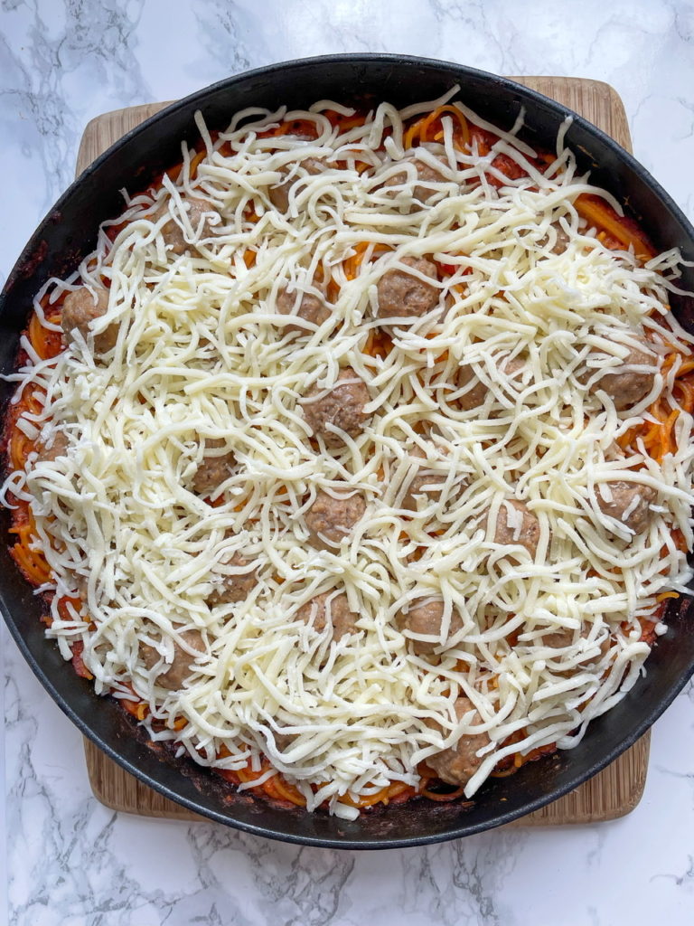 No Boil Spaghetti Bake with Meatballs and Cheese going in the oven