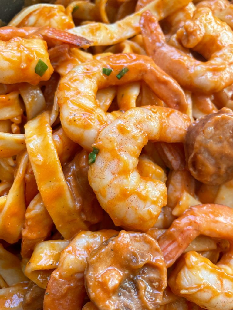 shrimp and smoked sausage with pasta in a creamy cajun sauce