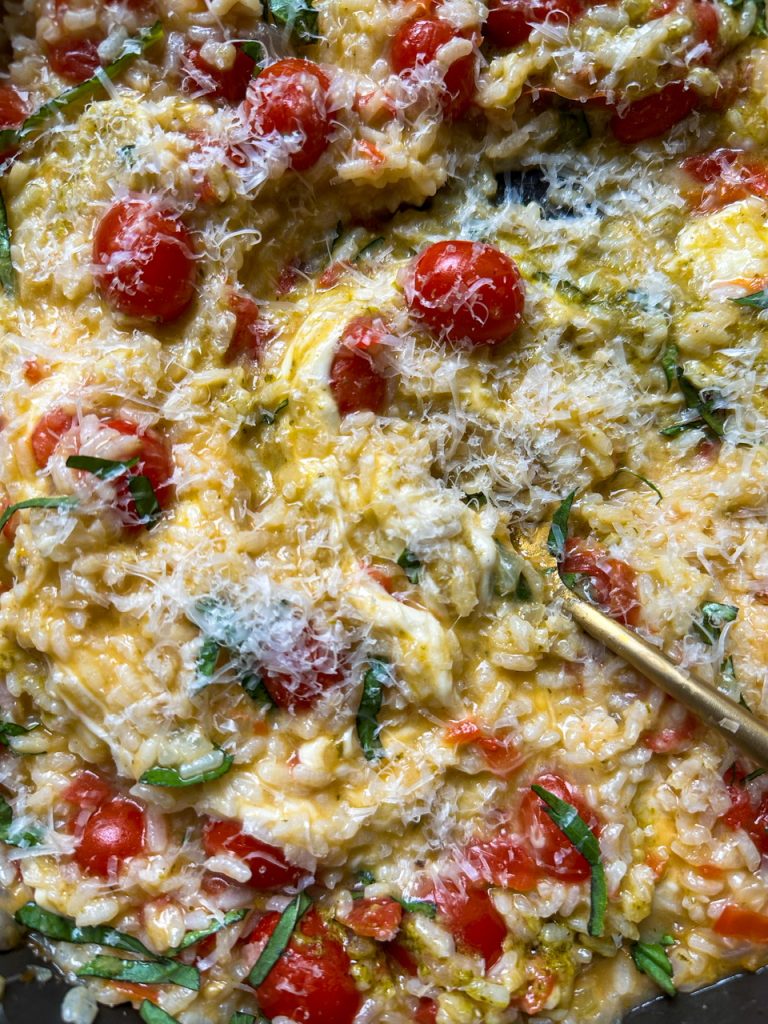 Creamy Caprese Risotto has creamy rice, juicy tomatoes, pesto, mozzarella, and fresh basil.