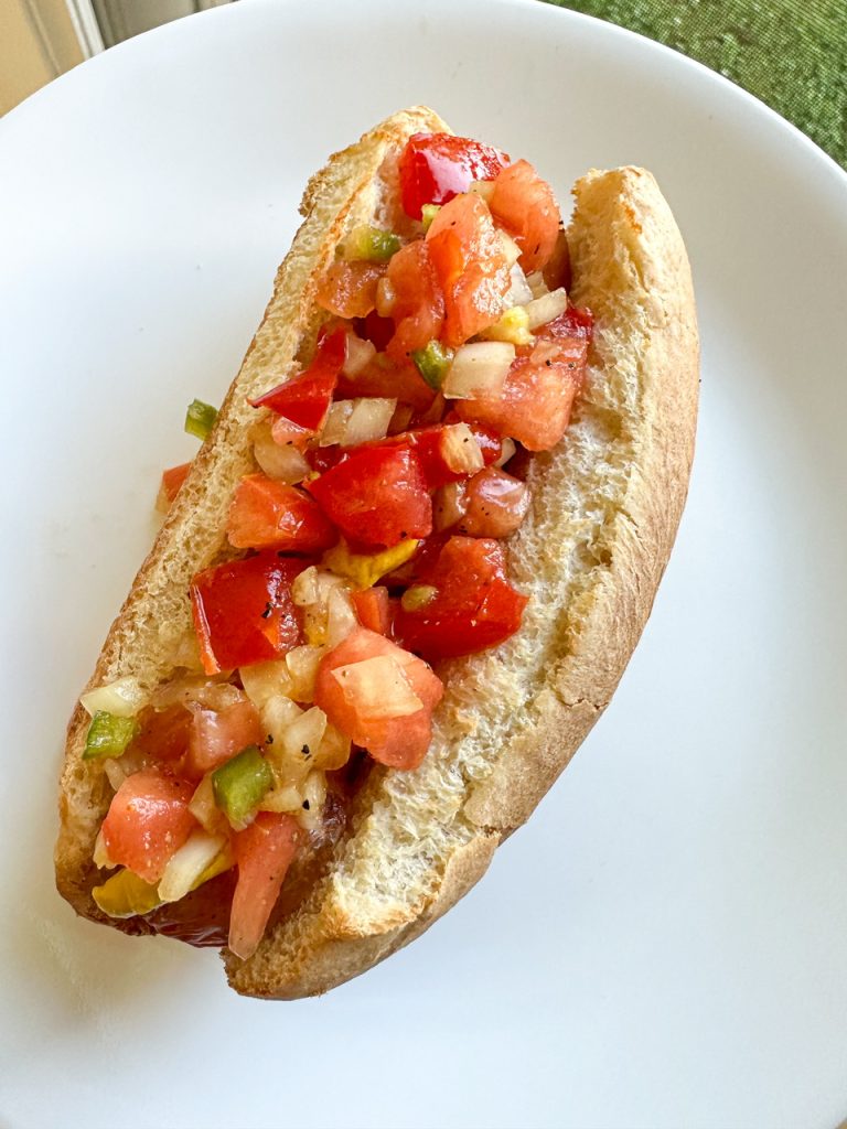 Hot Dog topped with Tomato Relish