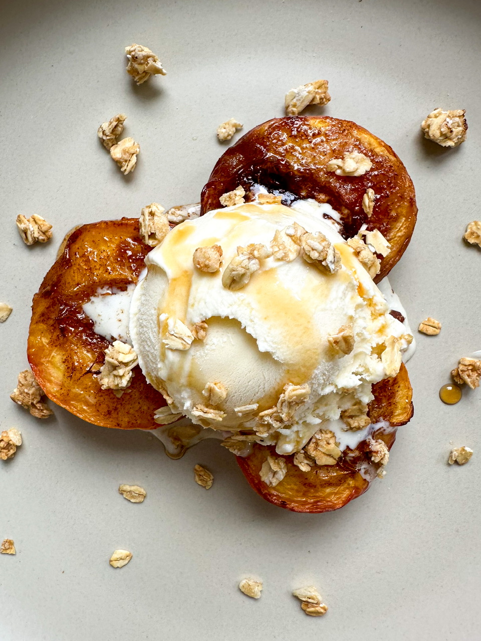 Air Fryer Peaches with Cinnamon Sugar Butter, Vanilla Ice Cream. Granola. and Maple Syrup