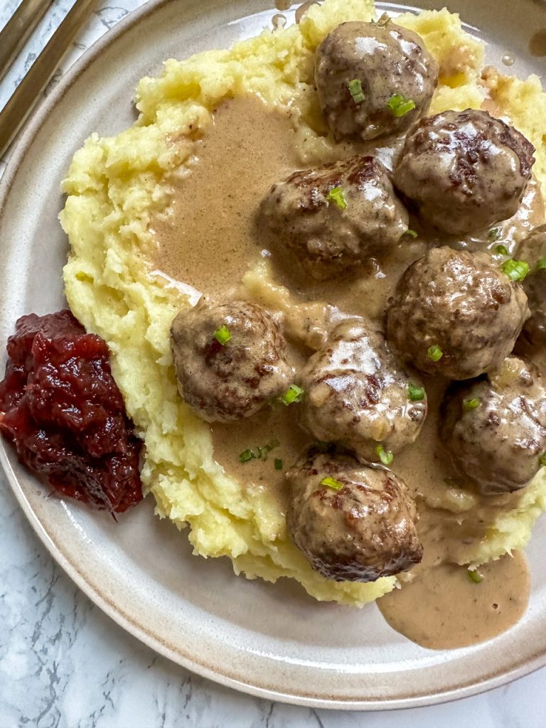 Swedish Meatballs (Köttbullar) served with mashed potatoes and cranberry sauce instead of lingonberries