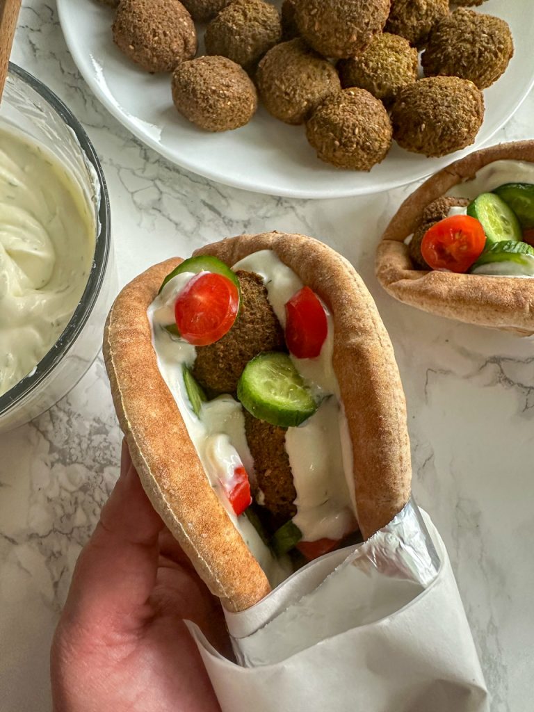 Falafel Gyros with whipped feta tzatziki, cucumbers and tomatoes