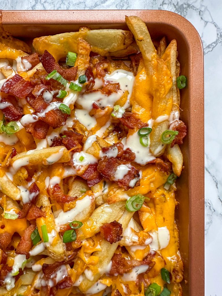 simple loaded fries with french fries, cheese, bacon, and ranch dressing