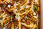 Loaded Fries with cheese, bacon, and ranch dressing