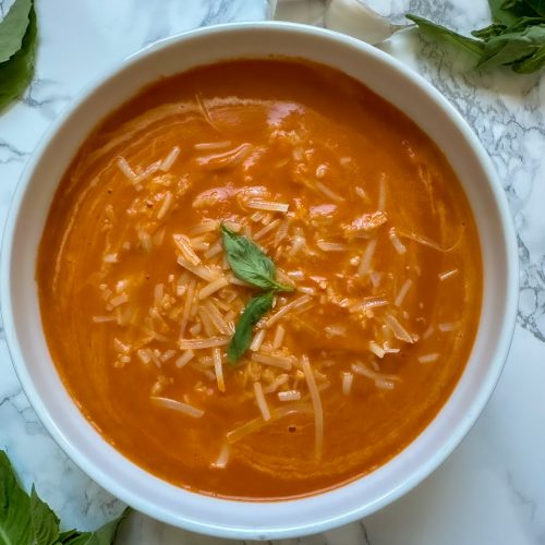 Tomato Soup topped with fresh parmesan cheese