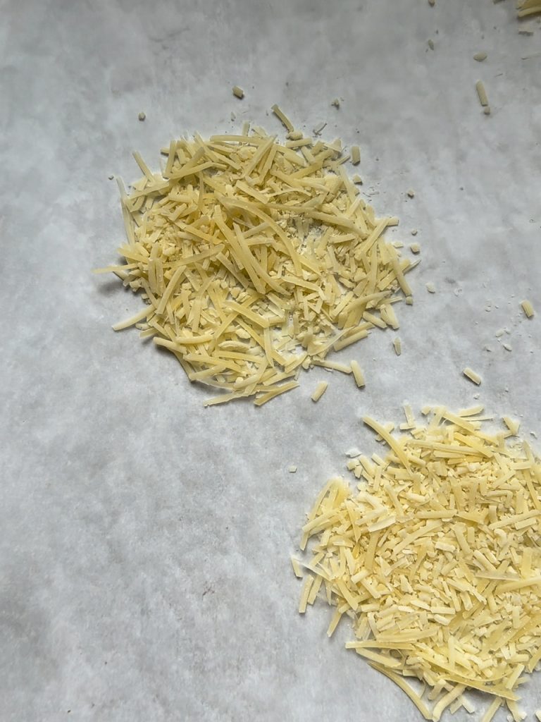 Shredded Parmesan about to be added to the oven to make an edible parmesan bowl