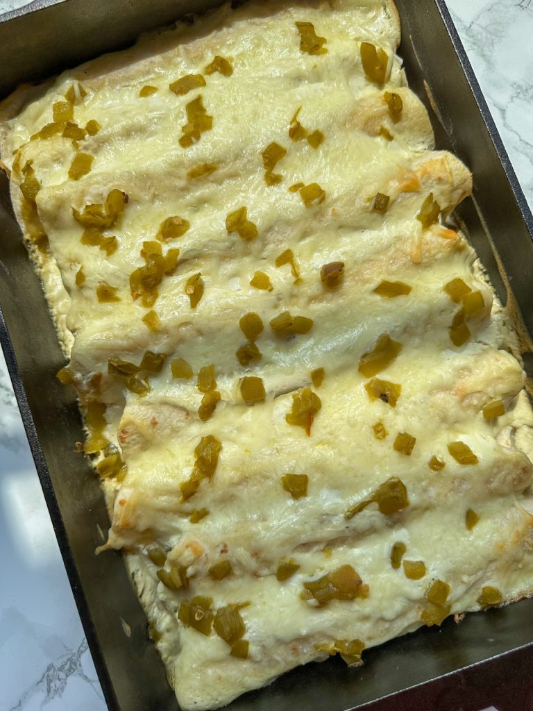 White Chicken Enchiladas made with Cottage Cheese, Cream Cheese, and Cotija Cheese