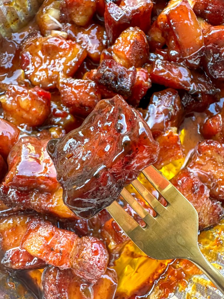 delicious piece of pork belly burnt ends made with bbq sauce and pepper jelly. 