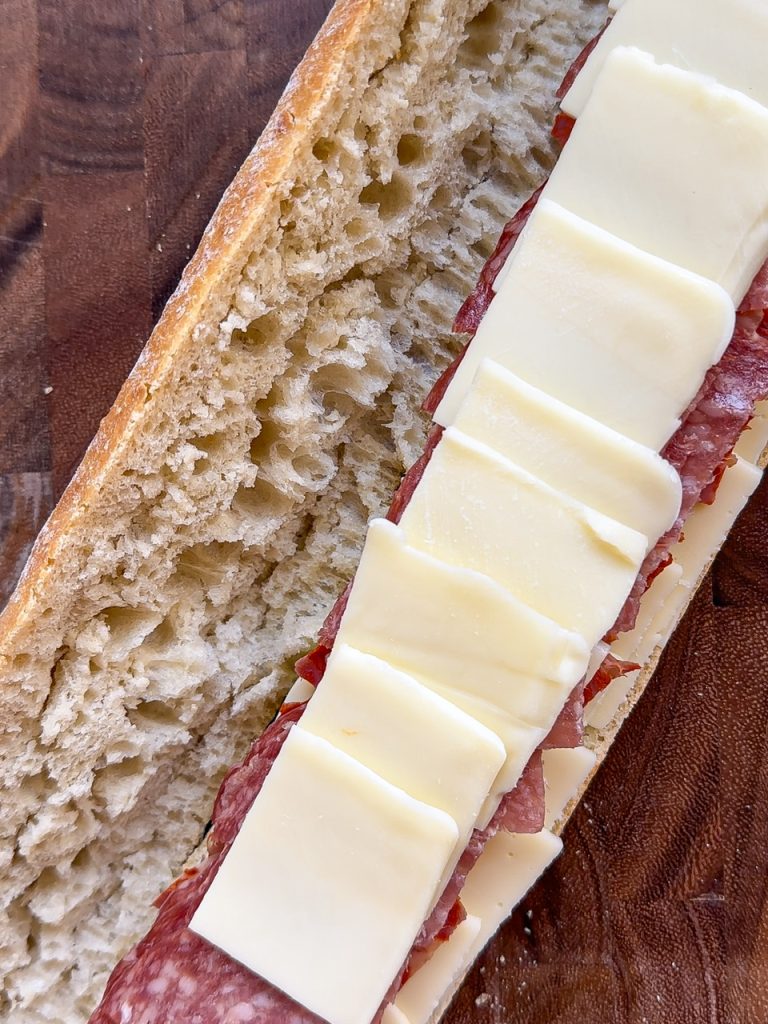 Baked Mozzarella Cheese, Provolone Cheese, Salami, and Capicola on a French Bread