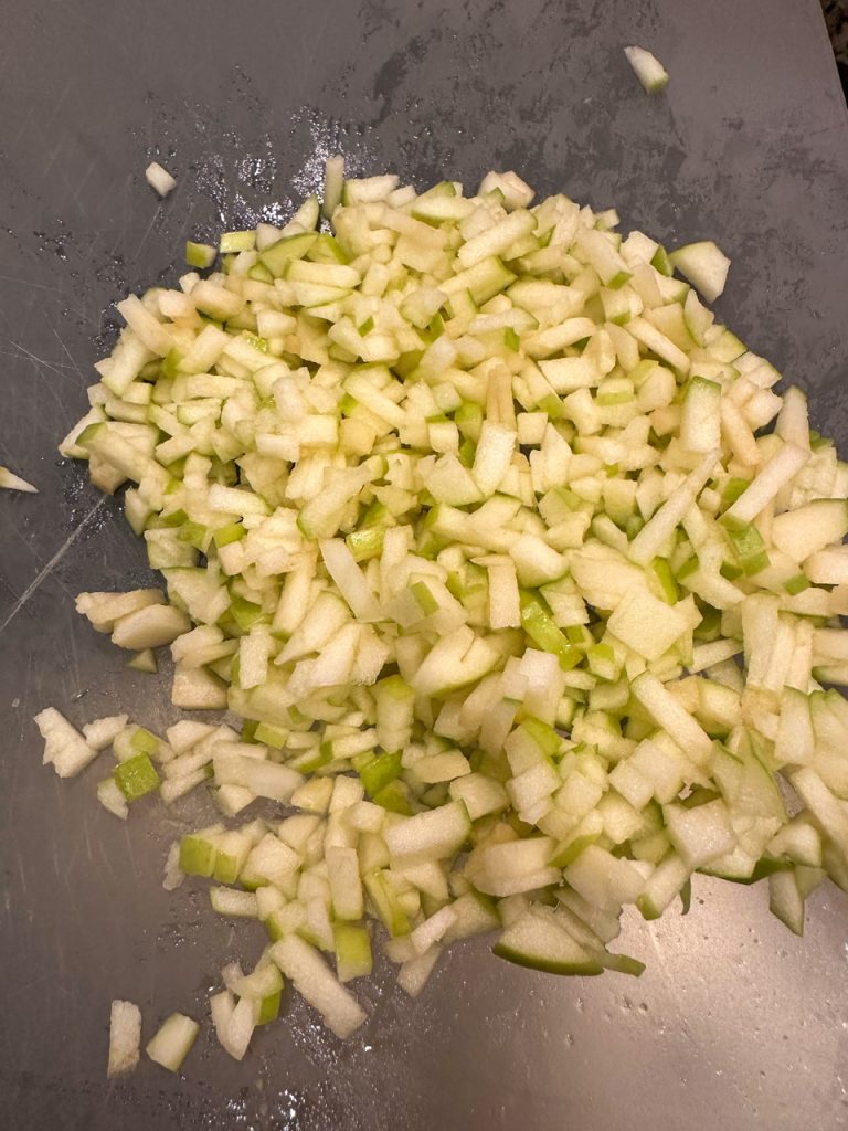 chopped up apple for the sausage rolls