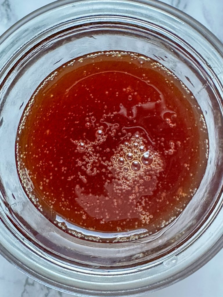 Apple Cider Syrup poured into a jar