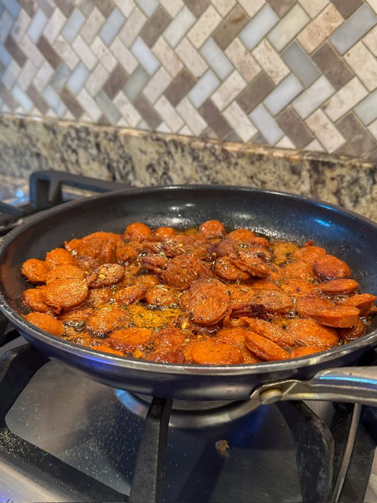 Adding spices to my chorizo before I add the shrimp