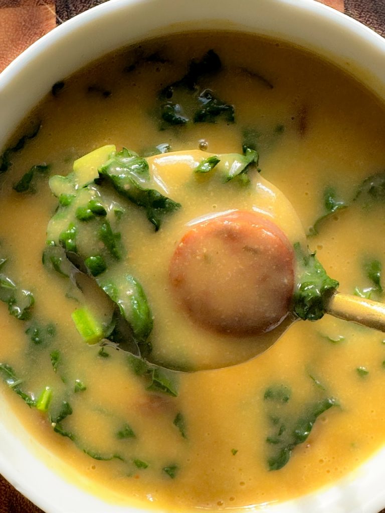 close up of chorizo in caldo verde