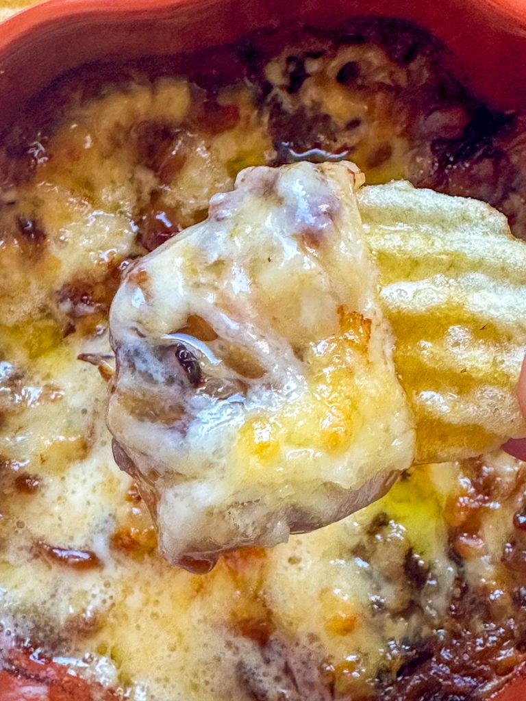 hot onion dip made with brie and gruyere cheese