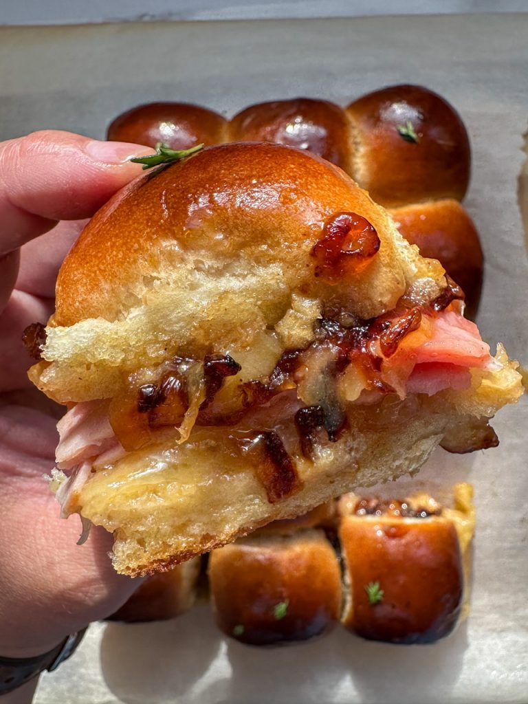 Hot ham and cheese sliders with apple jam and caramelized onions