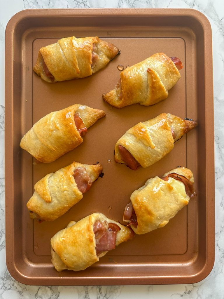 baked brie and jam crescent rolls with prosciutto