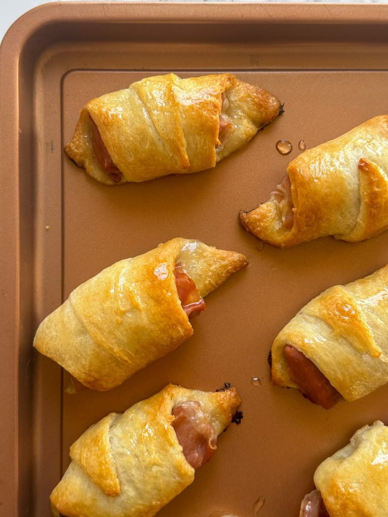 Baked brie, apple jam, and prosciutto crescent rolls
