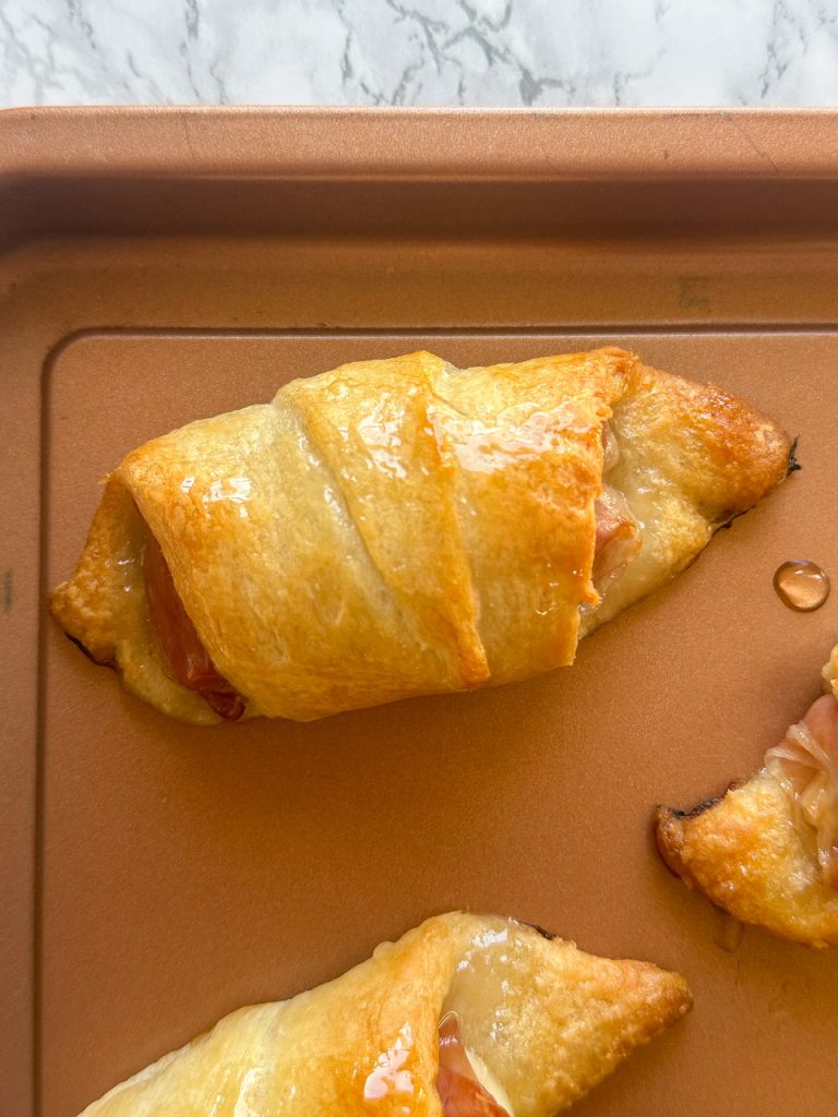 Baked brie crescent rolls with apple jam and prosciutto