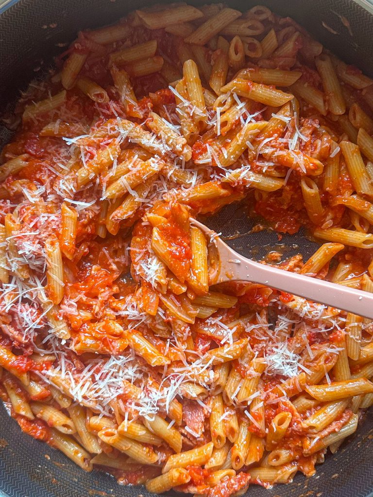 This penne Amatriciana recipe has bacon, crushed tomatoes, white wine, and freshly grated pecorino romano cheese.