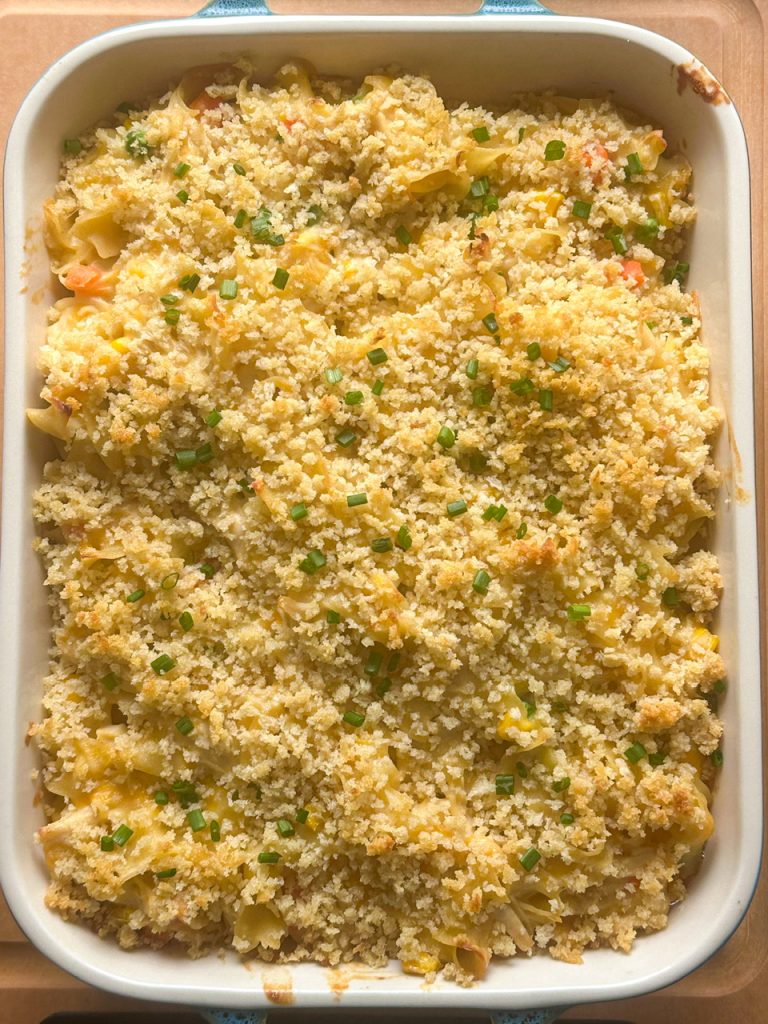 creamy chicken noodle casserole topped with buttery panko breadcrumbs