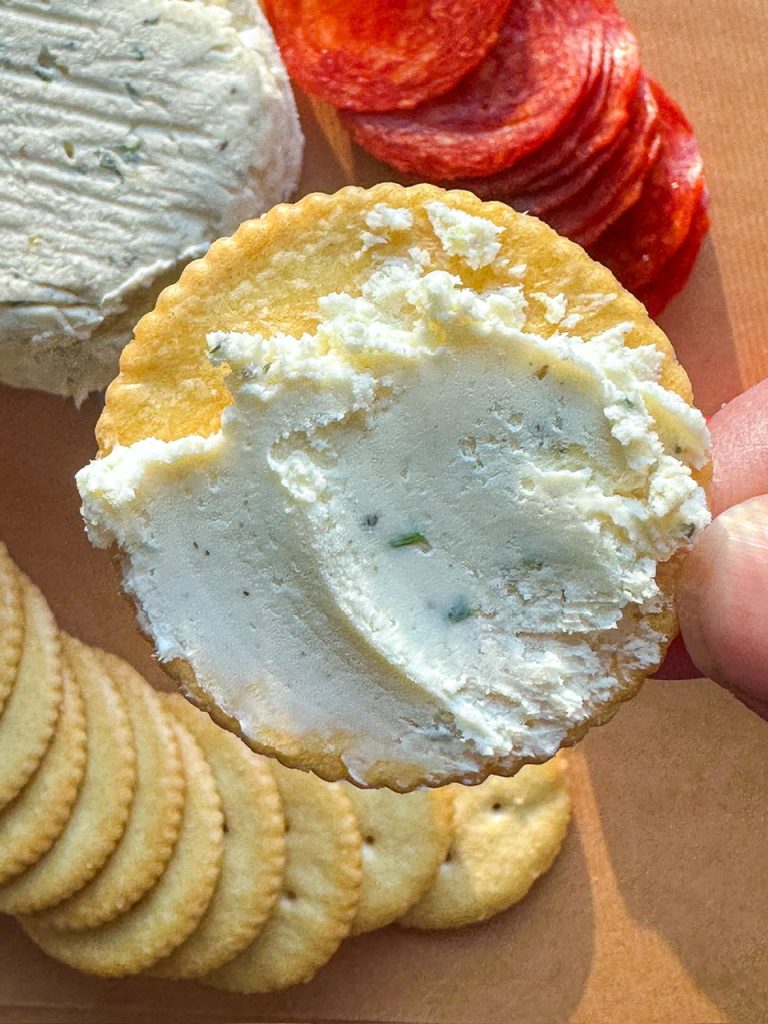 homemade boursin cheese spread on to a cracker