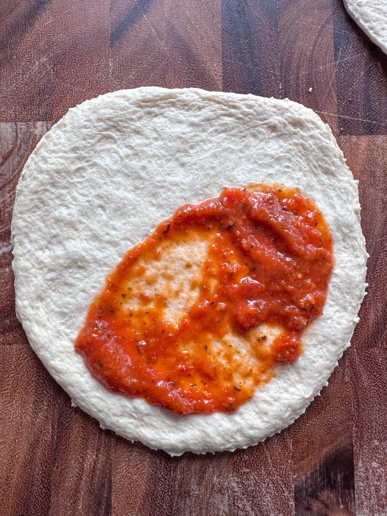 pizza dough with sauce